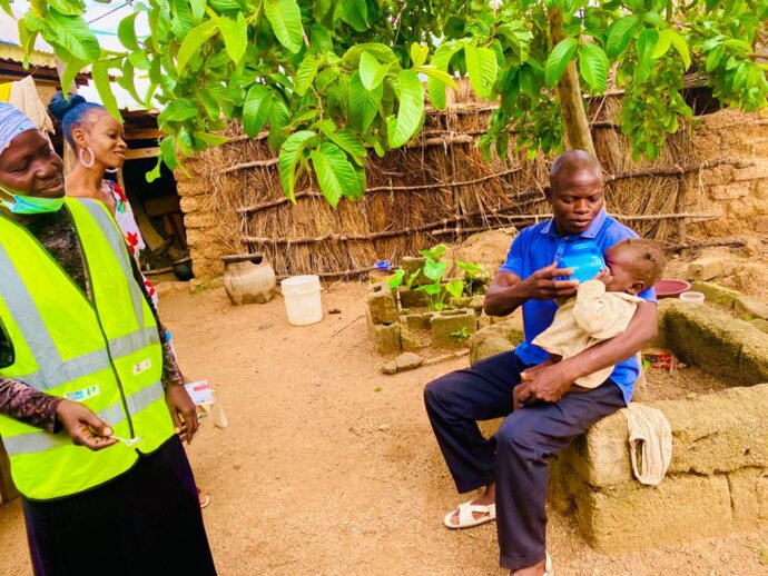 Photo: father administering SMC in Nigeria